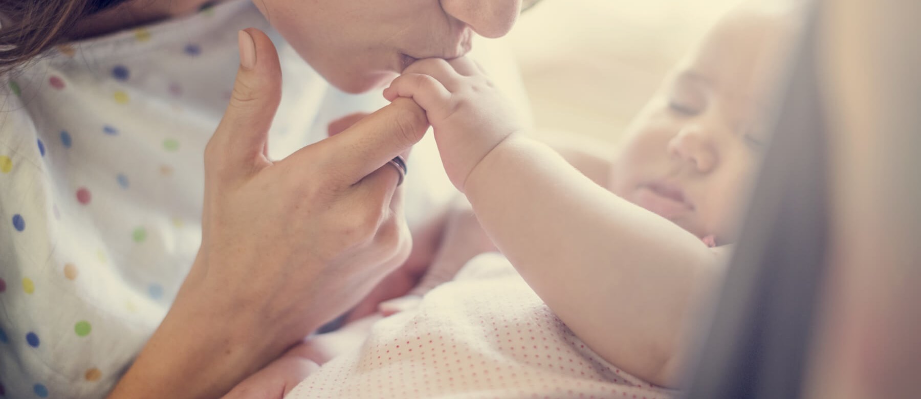 Mother Kissing Baby Mother Kissing Baby's Hand